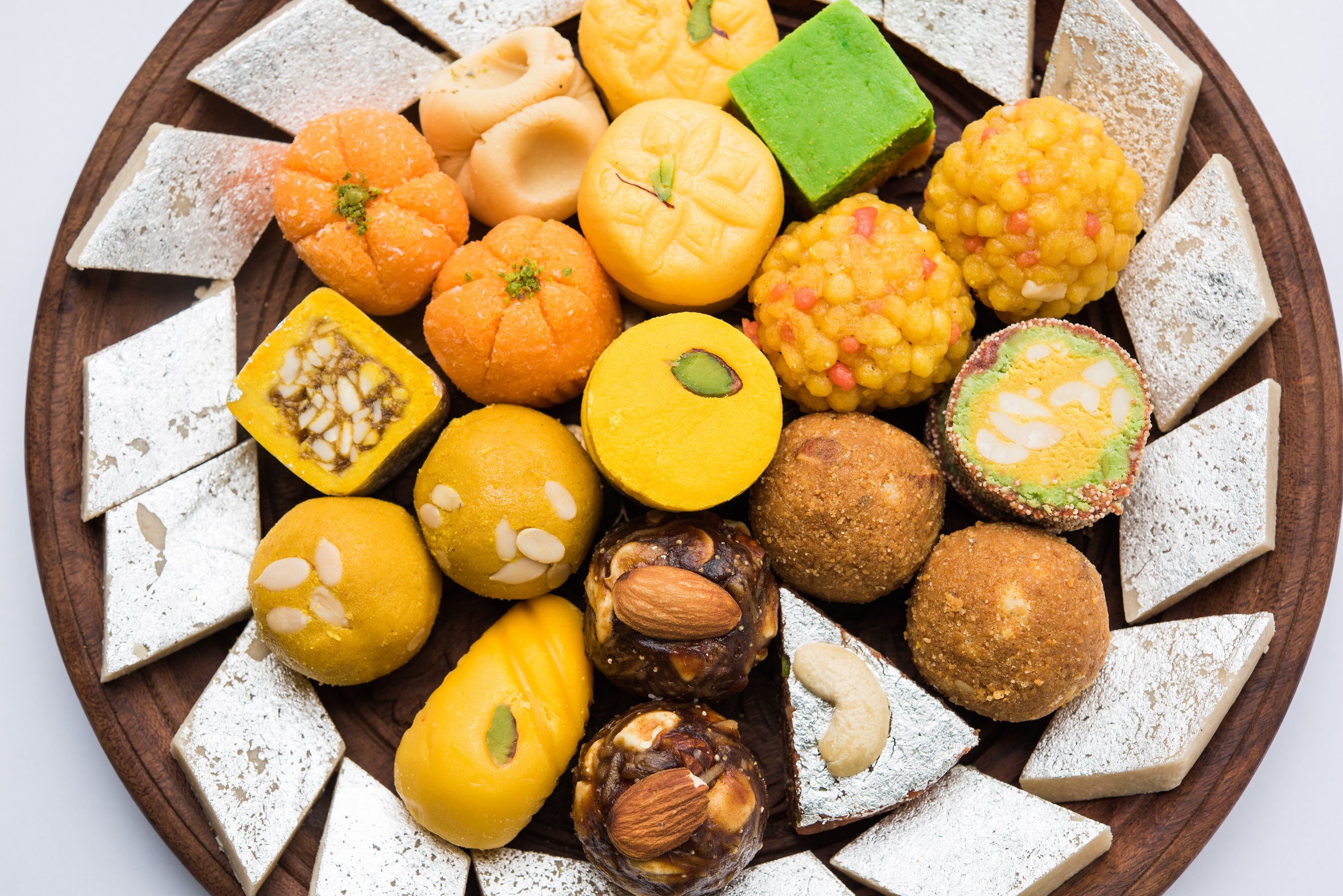 colorful indian sweets on a wooden tray 2026 09 23 02 32 12 utc